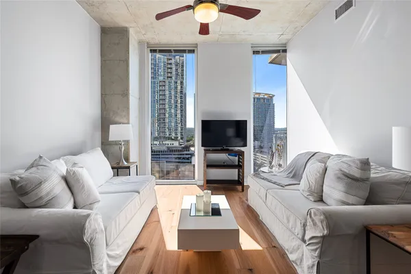 a view of balcony with outdoor seating and city view