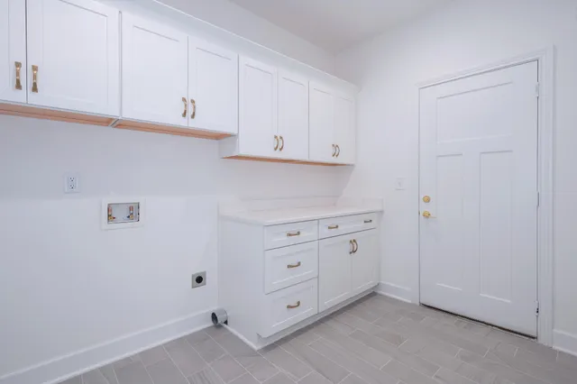 a view of cabinets and window in a kitchen