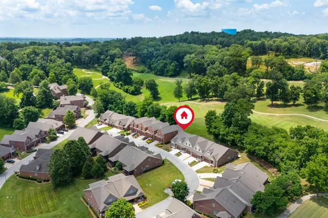an aerial view of a house with a garden