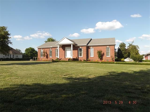 296 Rabbit Trail Road Leoma, TN 38468 - Photo 1 of 15 a front view of a house with a garden