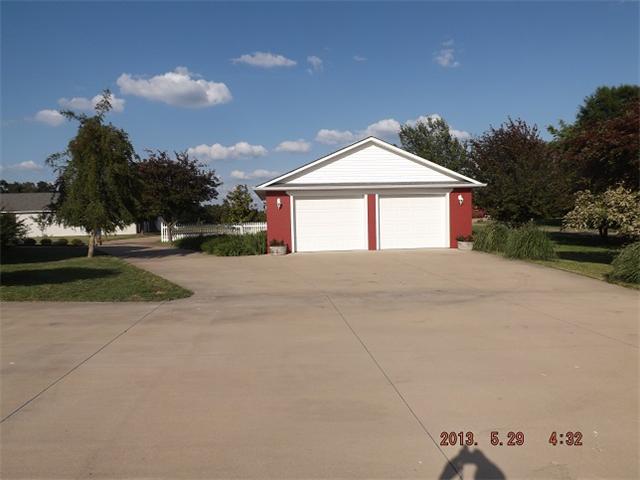 296 Rabbit Trail Road Leoma, TN 38468 - Photo 14 of 15 a front view of a house with a yard and garage