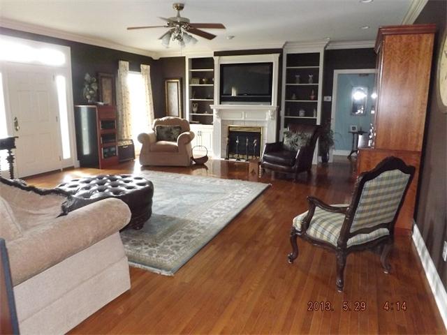 296 Rabbit Trail Road Leoma, TN 38468 - Photo 2 of 15 a living room with furniture fireplace and flat screen tv