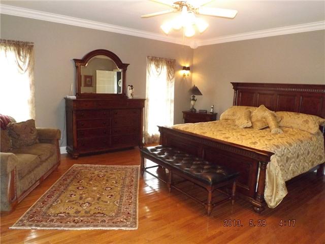 296 Rabbit Trail Road Leoma, TN 38468 - Photo 8 of 15 a bed room with a bed and a dresser