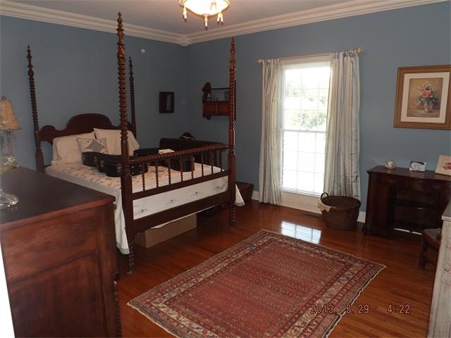 296 Rabbit Trail Road Leoma, TN 38468 - Photo 10 of 15 a bedroom with a bed and wooden floor