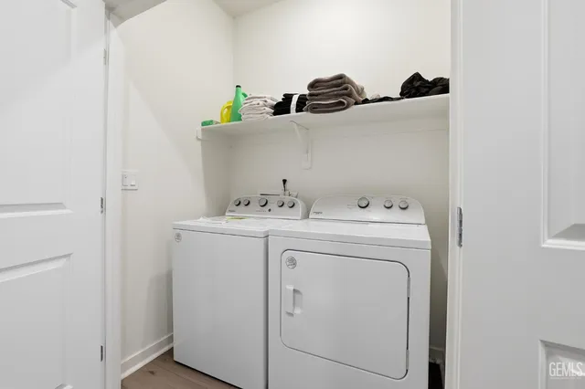 a view of a bedroom with a bed and a window