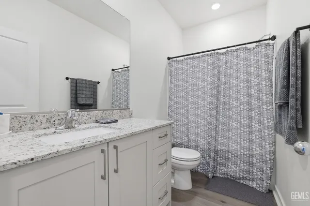 a view of a big house with a big yard and large trees