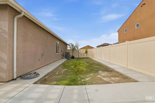 an aerial view of a house with swimming pool