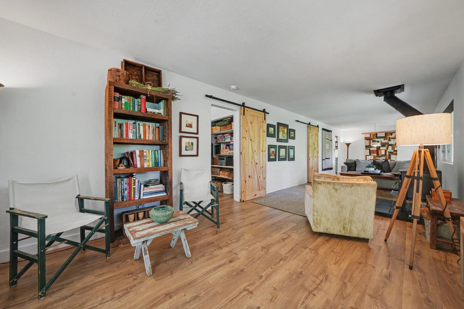 16308 Emigrant Trail Volcano, CA 95689 - Photo 5 of 29 a living room with furniture and a wooden floor