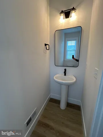 a white toilet sitting next to a window