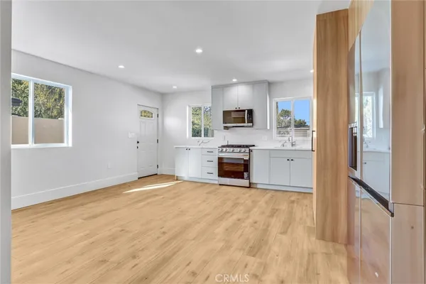 a view of a kitchen with furniture and a fireplace