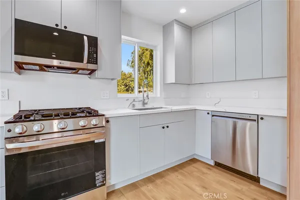 a kitchen with a stove and a microwave