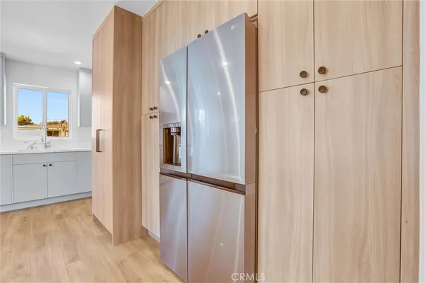 a bathroom with a shower and a glass door