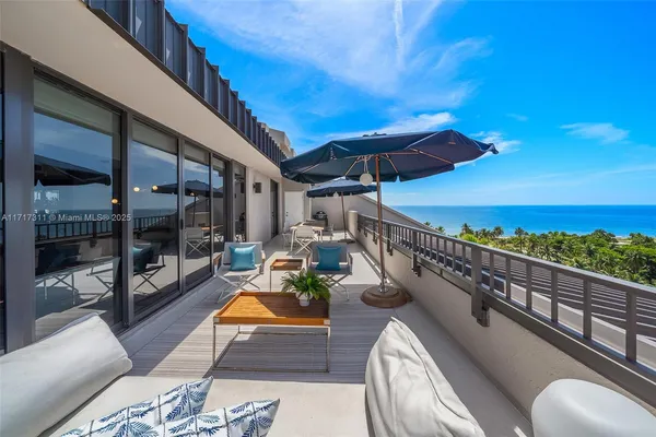 a view of a patio with a table and chairs