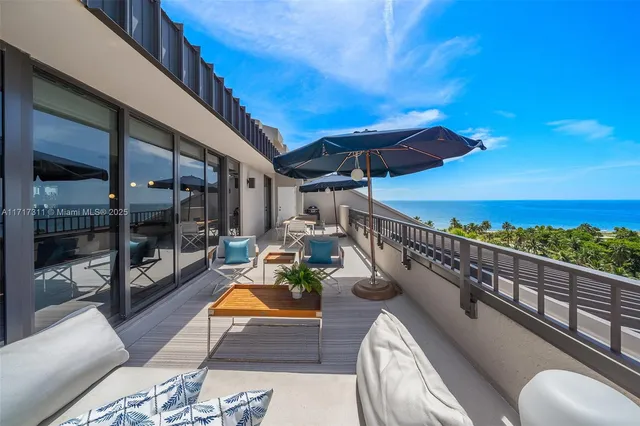 a view of a patio with a table and chairs