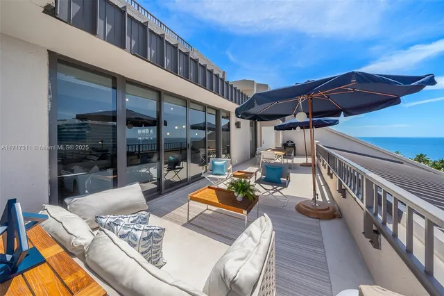 a view of balcony with furniture