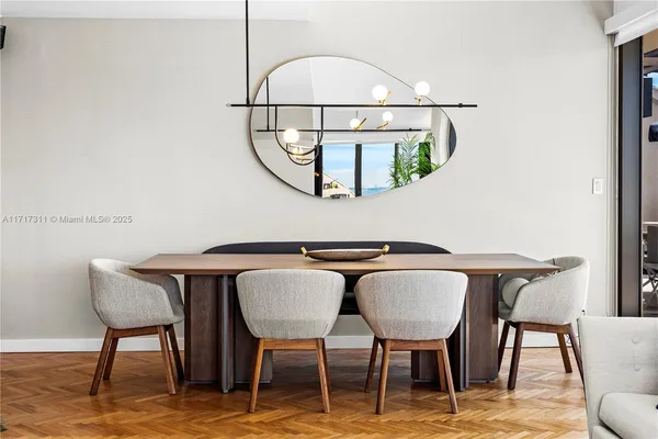 a bedroom with furniture and a rug