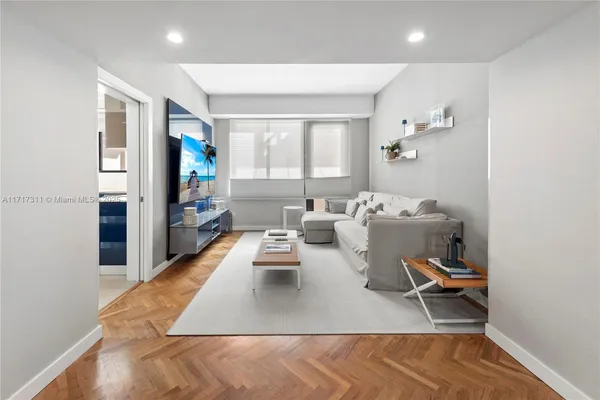 a large kitchen with a table and chairs