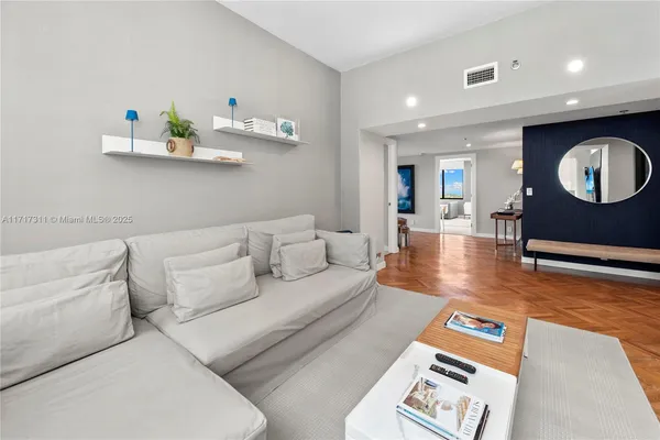 a kitchen with stainless steel appliances kitchen island granite countertop a refrigerator and a sink