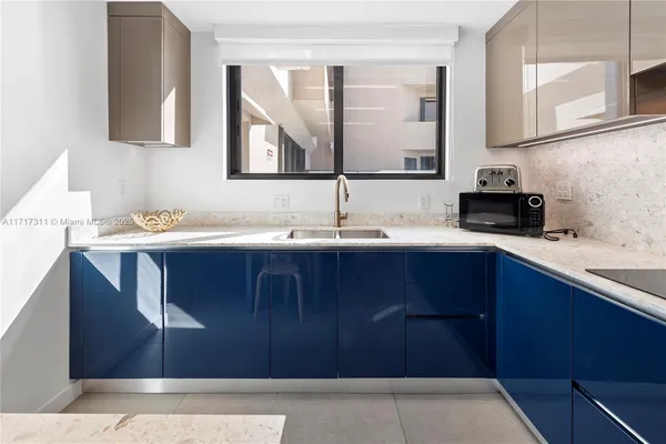 a room with a table lamp and a window