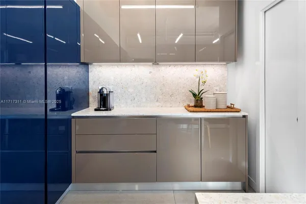 a bedroom with a large bed and a large window