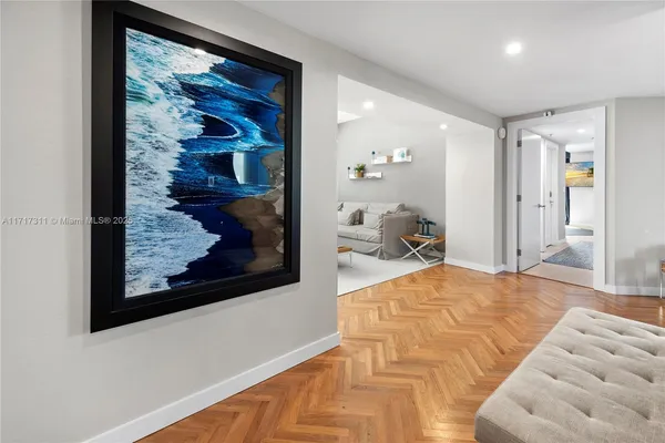 a bed room with two beds and a chair