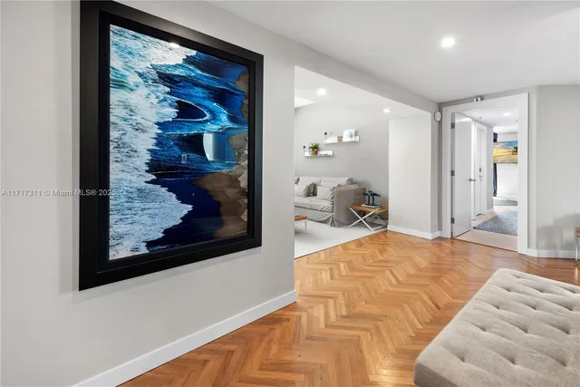 a bed room with two beds and a chair