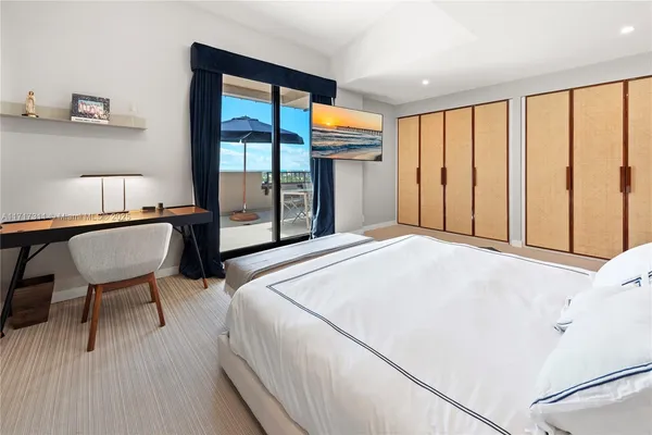 a bed room with a bed and a large window