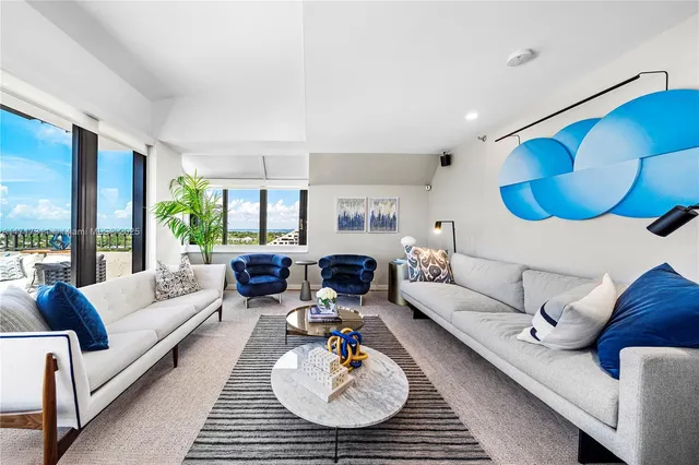 a living room with furniture and a table