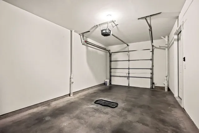 a view of a white house with large windows