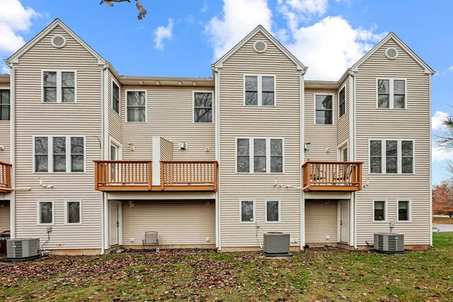 a view of a white building among the street