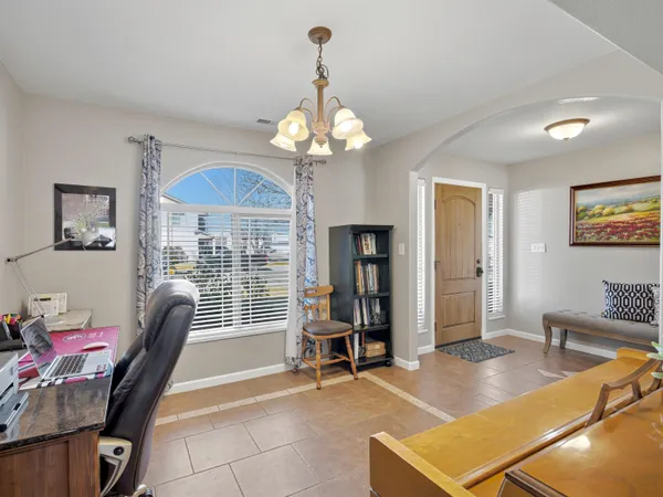a room with furniture and chandelier
