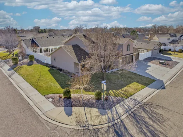 an aerial view of a house with a swimming pool