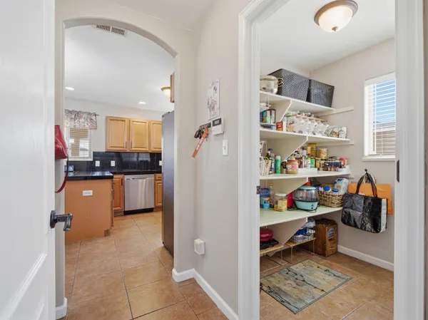 a kitchen with stainless steel appliances a refrigerator and cabinets
