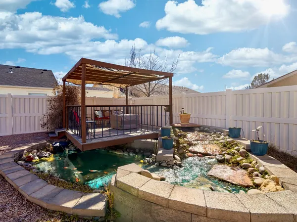 a view of a backyard with sitting area and furniture