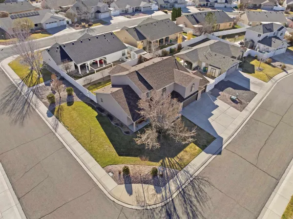 an aerial view of a house with a swimming pool and outdoor seating