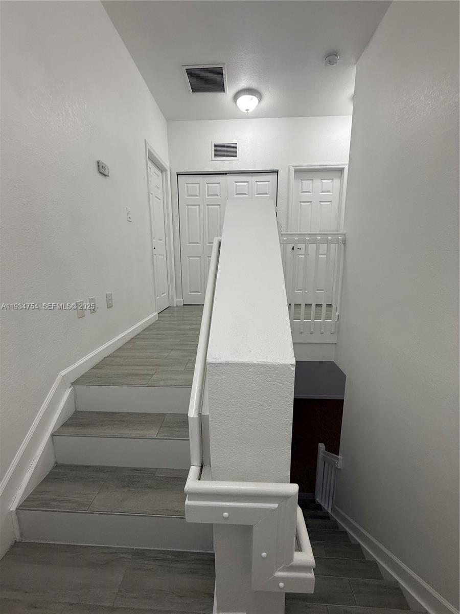 9248 Southwest 170th Place, Unit 9248 Miami, FL 33196 - Photo 16 of 30 a view of entryway with wooden floor