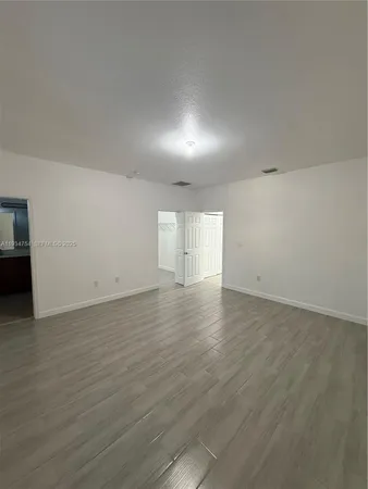 a bathroom with a mirror shower and sink