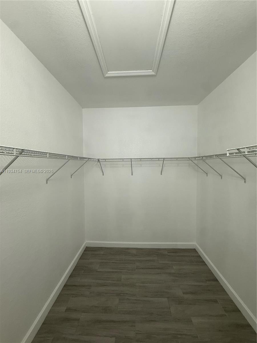 9248 Southwest 170th Place, Unit 9248 Miami, FL 33196 - Photo 20 of 30 a view of a room with racks on the wall