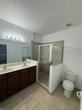 a bathroom with a sink a mirror and a toilet
