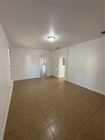 a view of empty room with windows