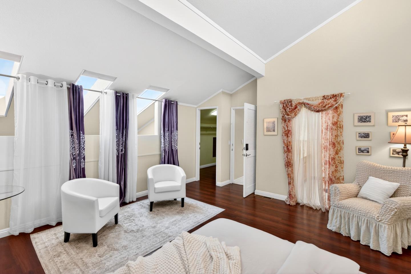 22330 Homestead Road, Unit 214 Cupertino, CA 95014 - Photo 21 of 35 a living room with furniture and a large window