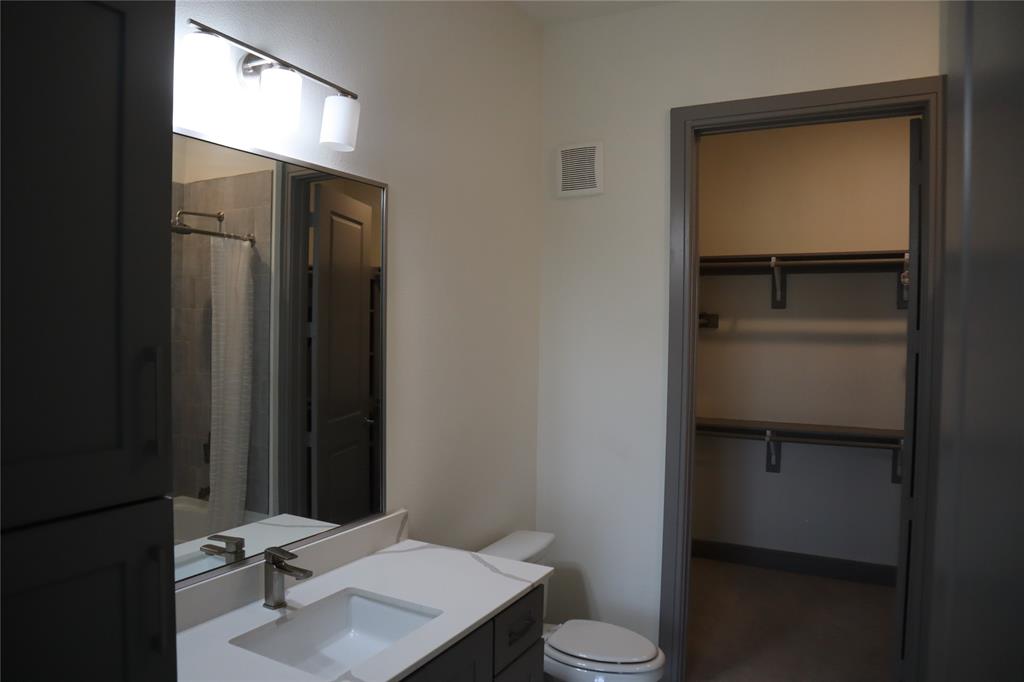 2700 Old Denton Road, Unit 3314 Carrollton, TX 75007 - Photo 8 of 14 a bathroom with a toilet sink and vanity