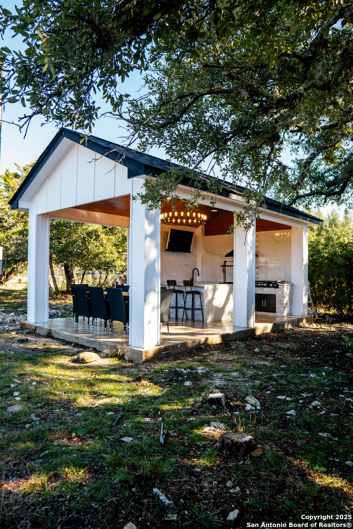 0 Pr 1509 Bandera, TX 78003 - Photo 1 of 8 a view of a house with backyard and sitting area