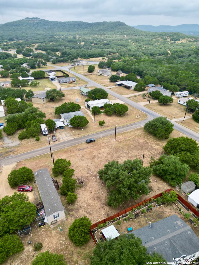 0 Pr 1509 Bandera, TX 78003 - Photo 5 of 8 an aerial view of residential houses with outdoor space and street view