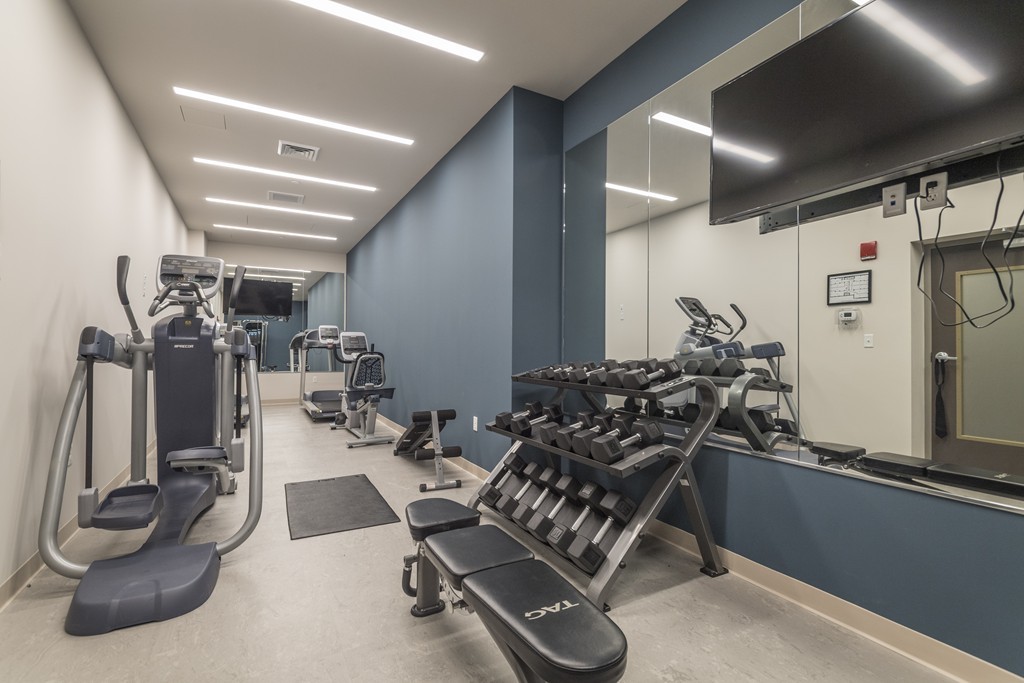 121 Portland Street, Unit 703 Boston, MA 02114 - Photo 11 of 13 a room with gym equipment