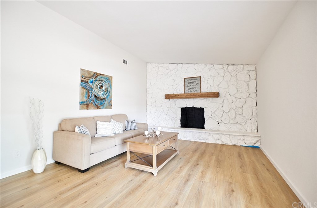 16061 Suttles Drive Riverside, CA 92504 - Photo 3 of 36 a living room with furniture and a fireplace