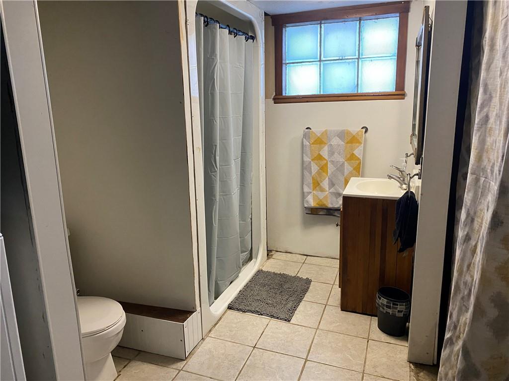 610 Chicora Road Butler, PA 16002 - Photo 23 of 24 a bathroom with a sink and a toilet