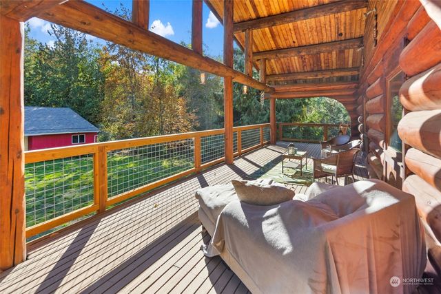 a view of balcony with couch and wooden floor