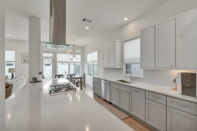 a kitchen with lots of counter top space and furniture