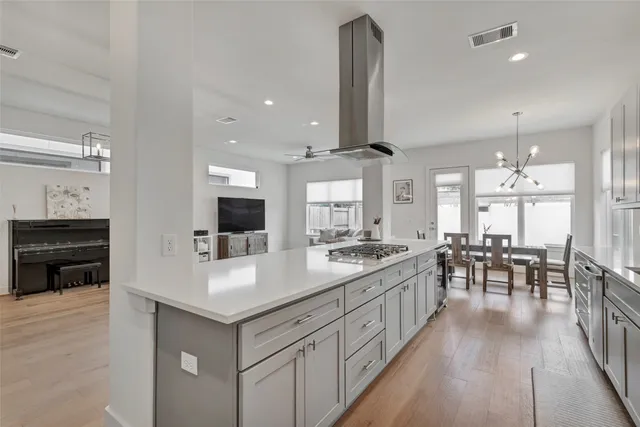 a kitchen with counter top space a sink stainless steel appliances and cabinets